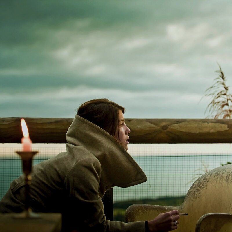 woman smoking on a balcony