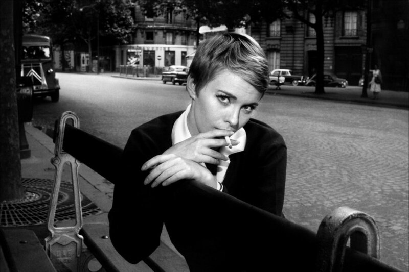 Woman smoking on a bench