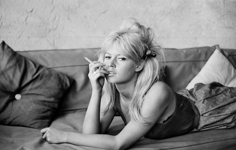 Woman smoking on a couch