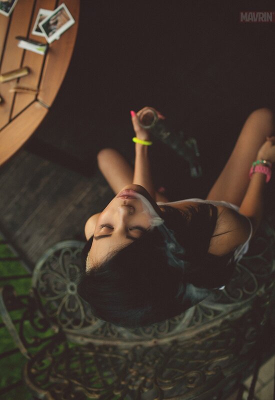 woman smoking on a patio