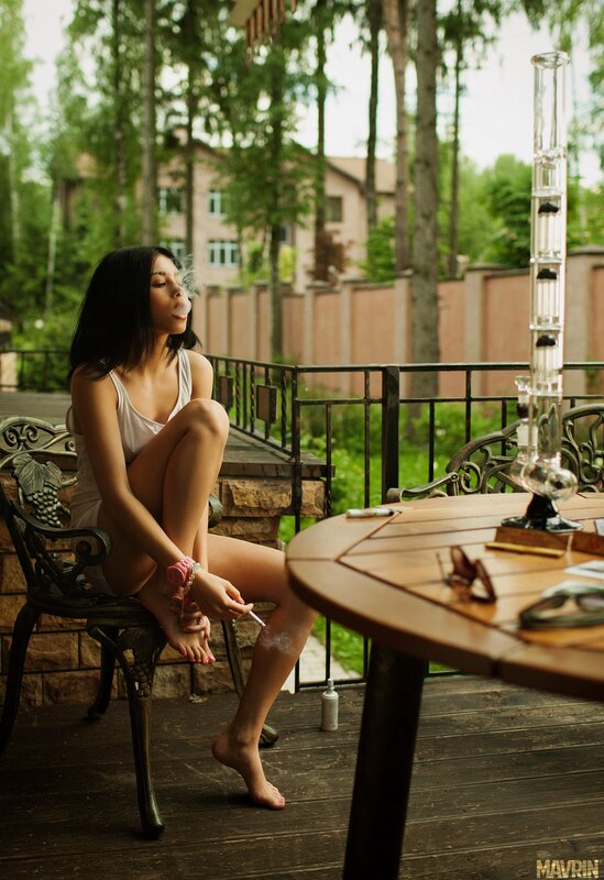 woman smoking on a patio