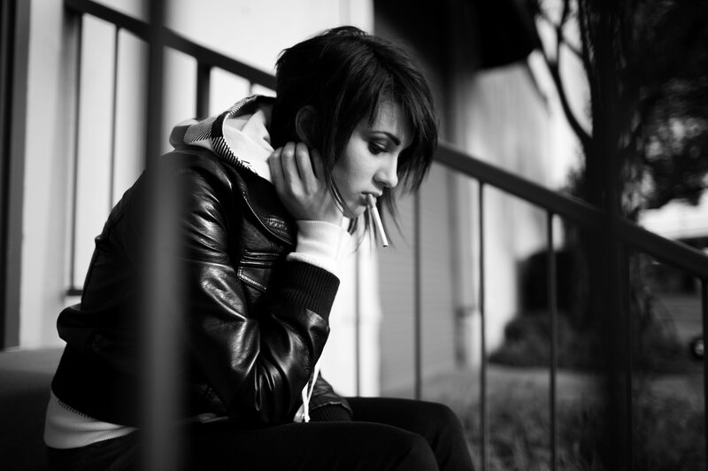 woman smoking on stairs