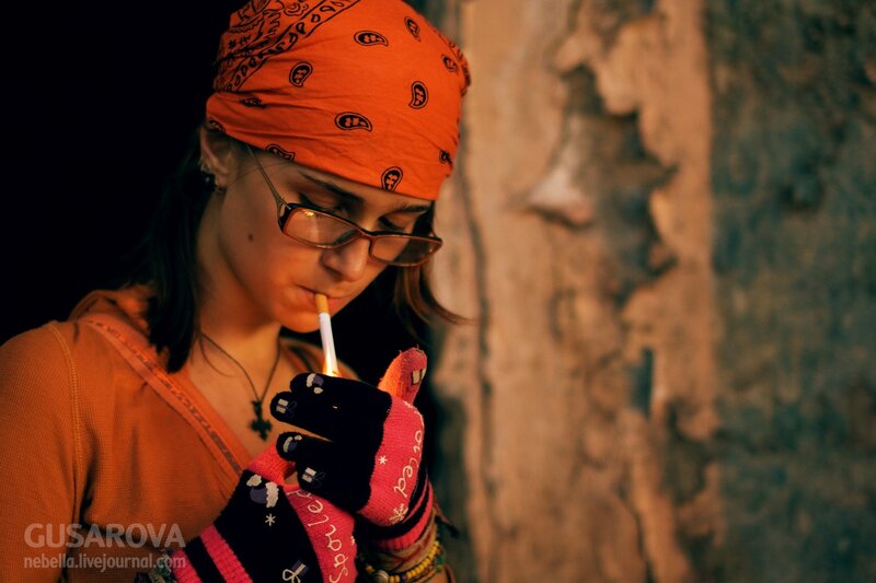 woman smoking with bandana