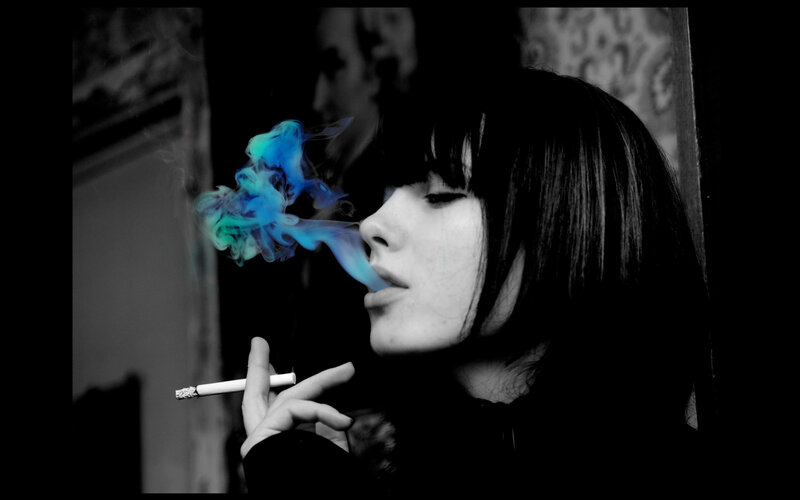 woman smoking with blue smoke
