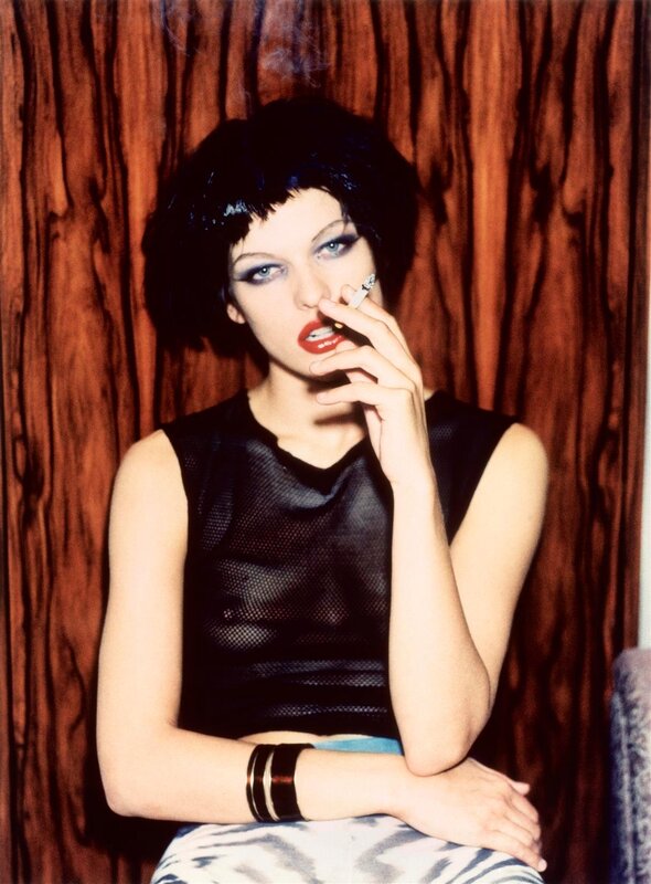 Woman smoking with bold makeup