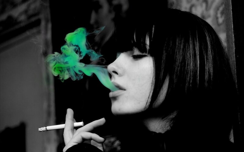 woman smoking with green smoke