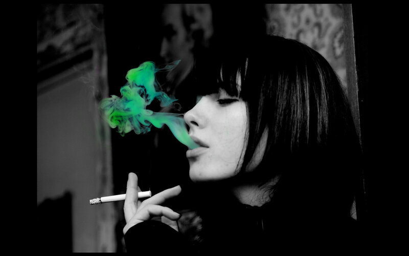 woman smoking with green smoke