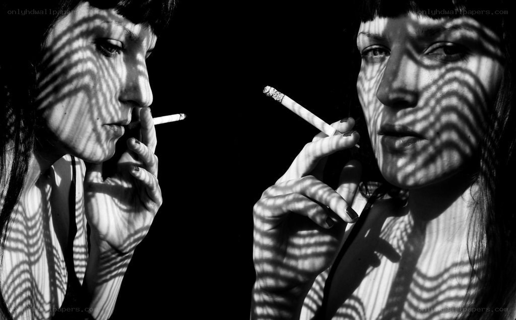 woman smoking with shadow patterns
