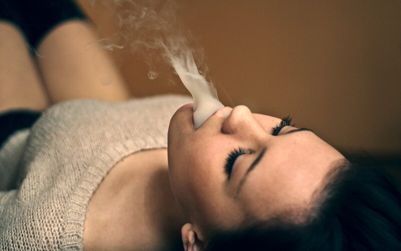 woman smoking with smoke