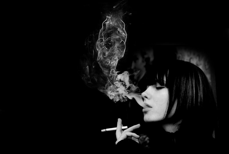 woman smoking with smoke skull