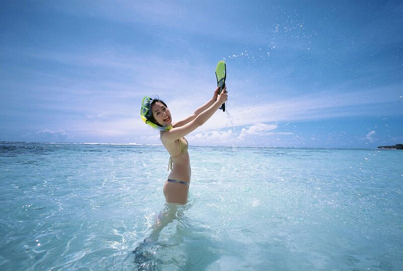 Woman snorkeling in clear water