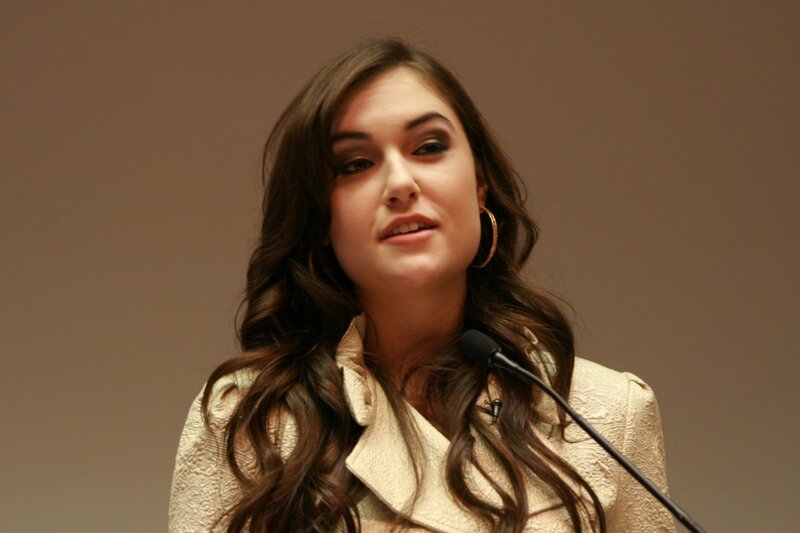 woman speaking at a podium