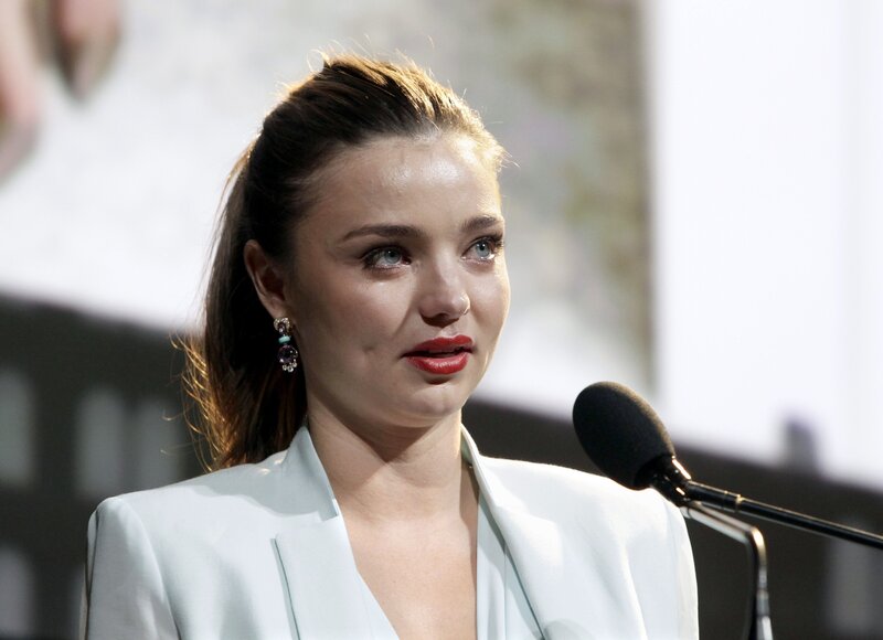 woman speaking at podium