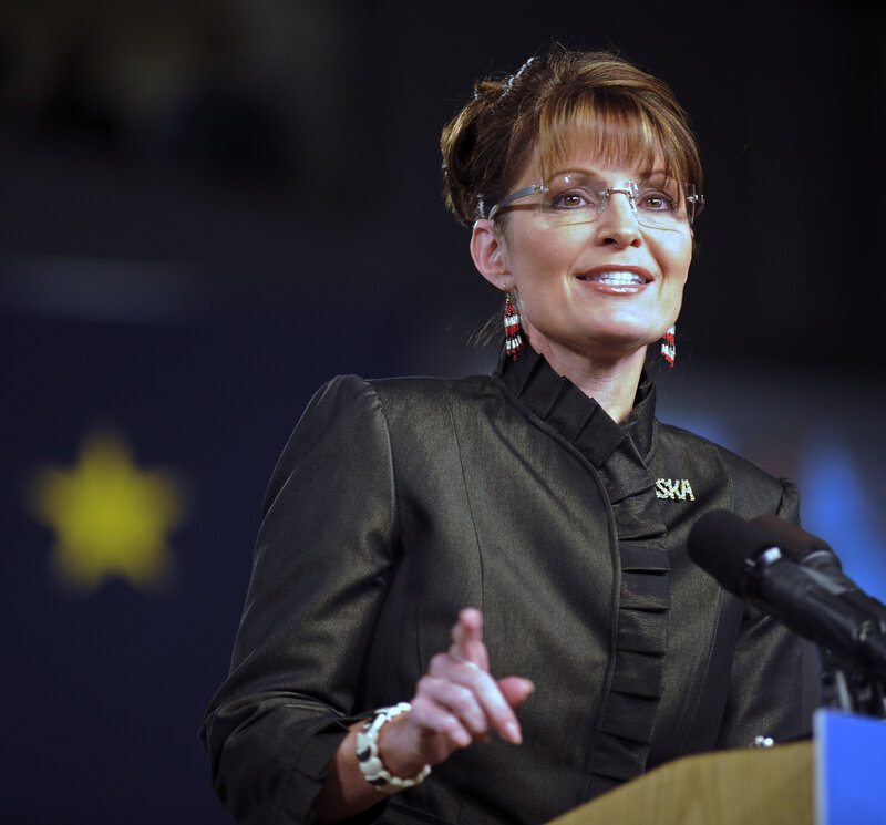woman speaking at podium