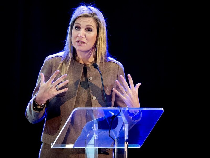 Woman Speaking at Podium — Brown, Formal