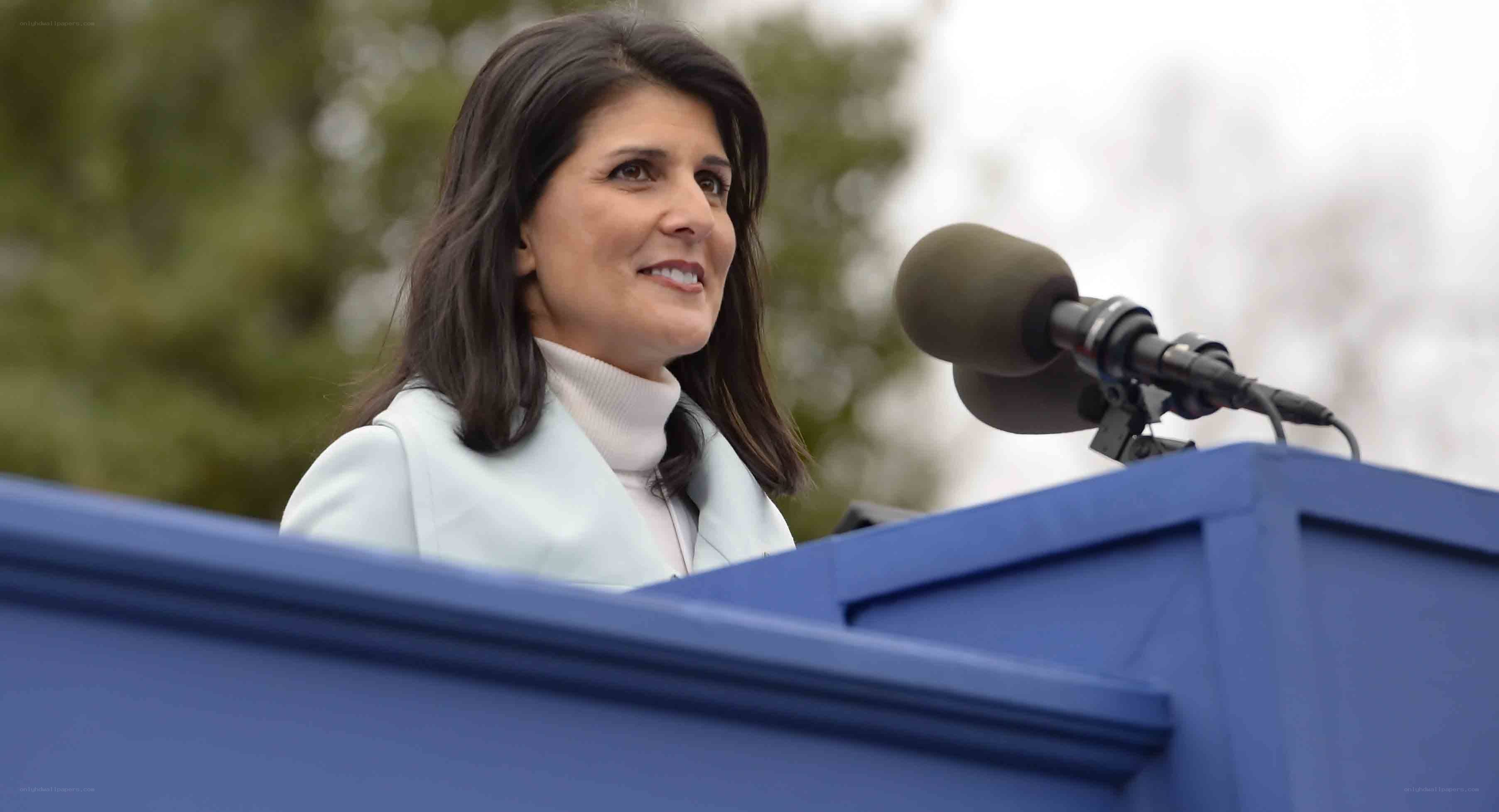 woman speaking at podium