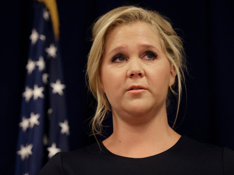 woman speaking at press event