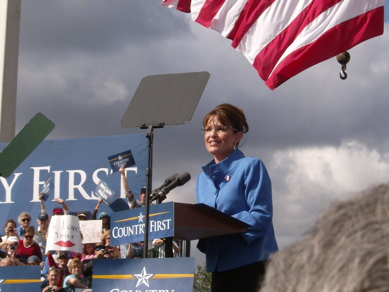 woman speaking at rally