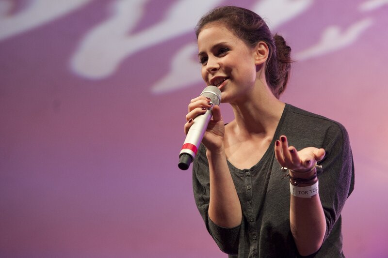 woman speaking into microphone