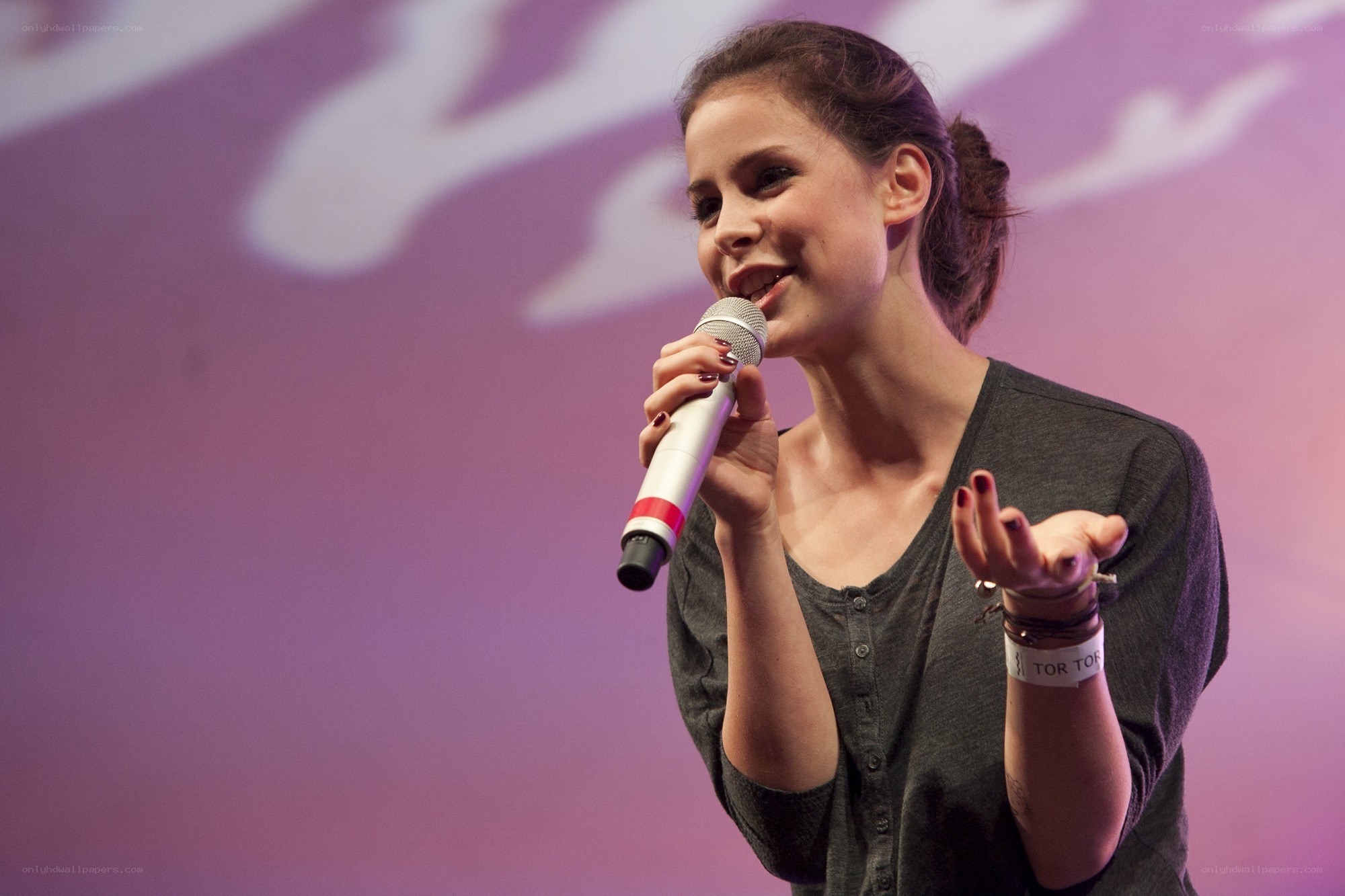 woman speaking into microphone