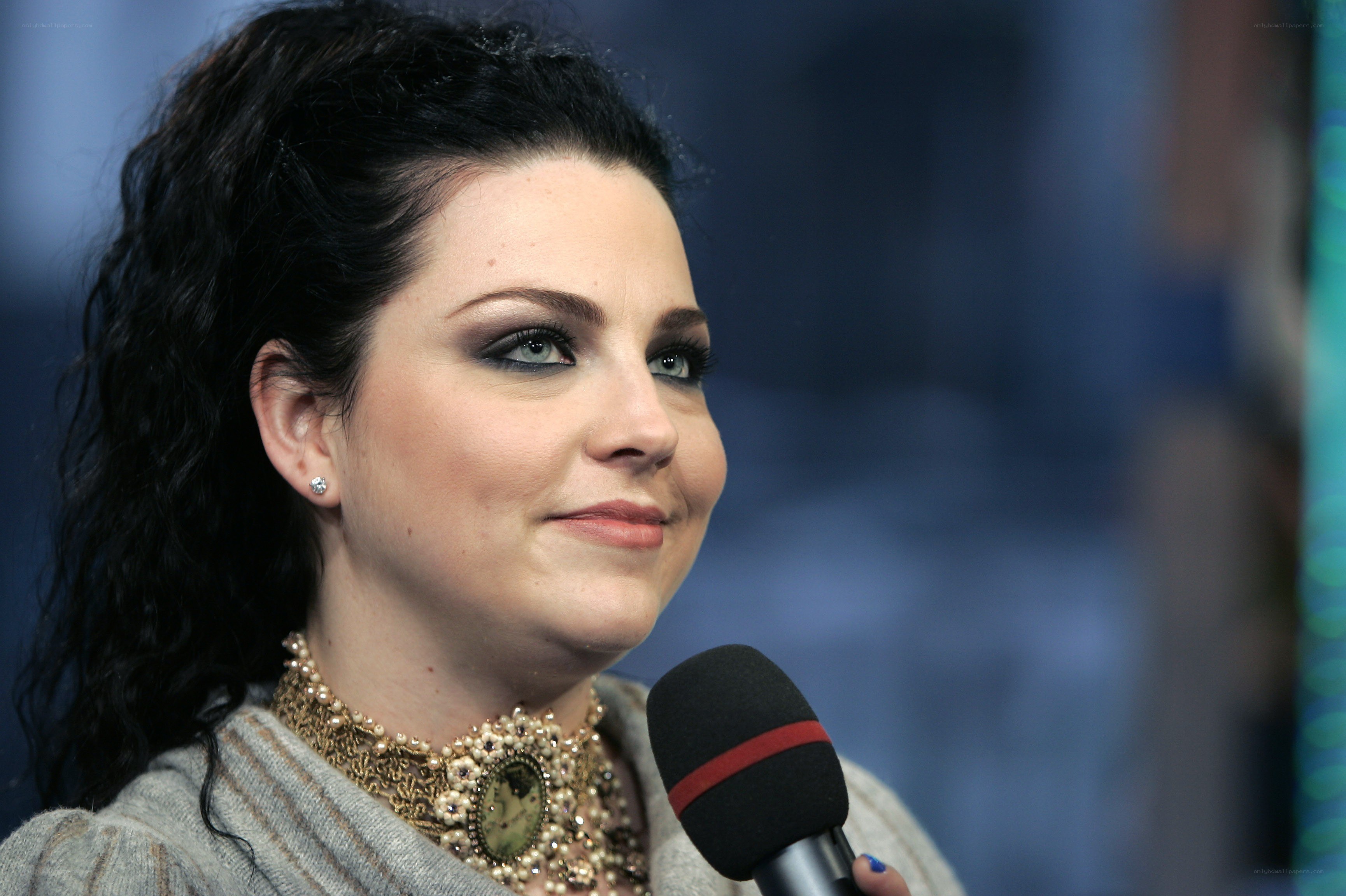 woman speaking into microphone