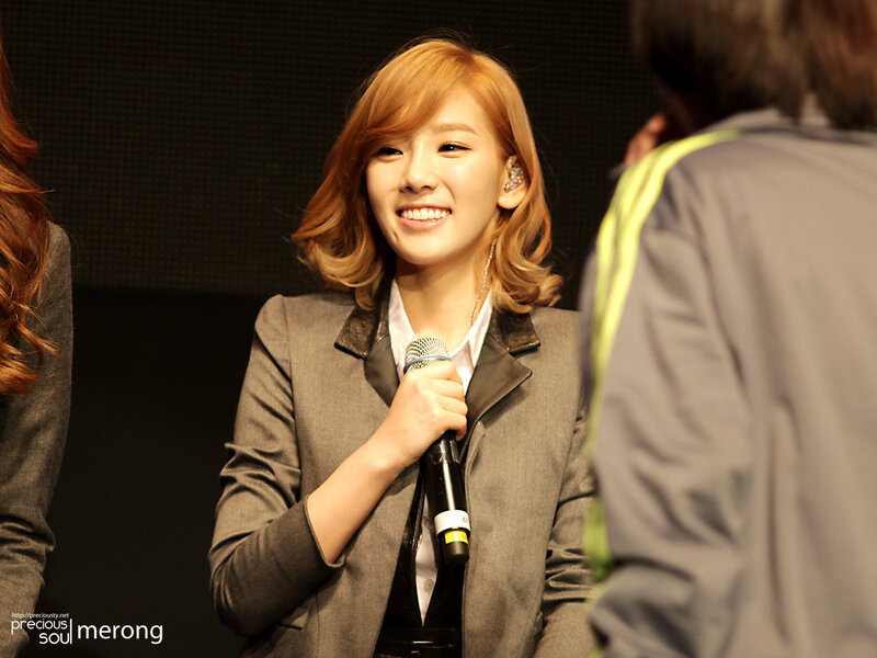 woman speaking into microphone