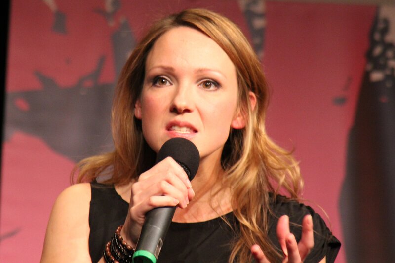 woman speaking into microphone
