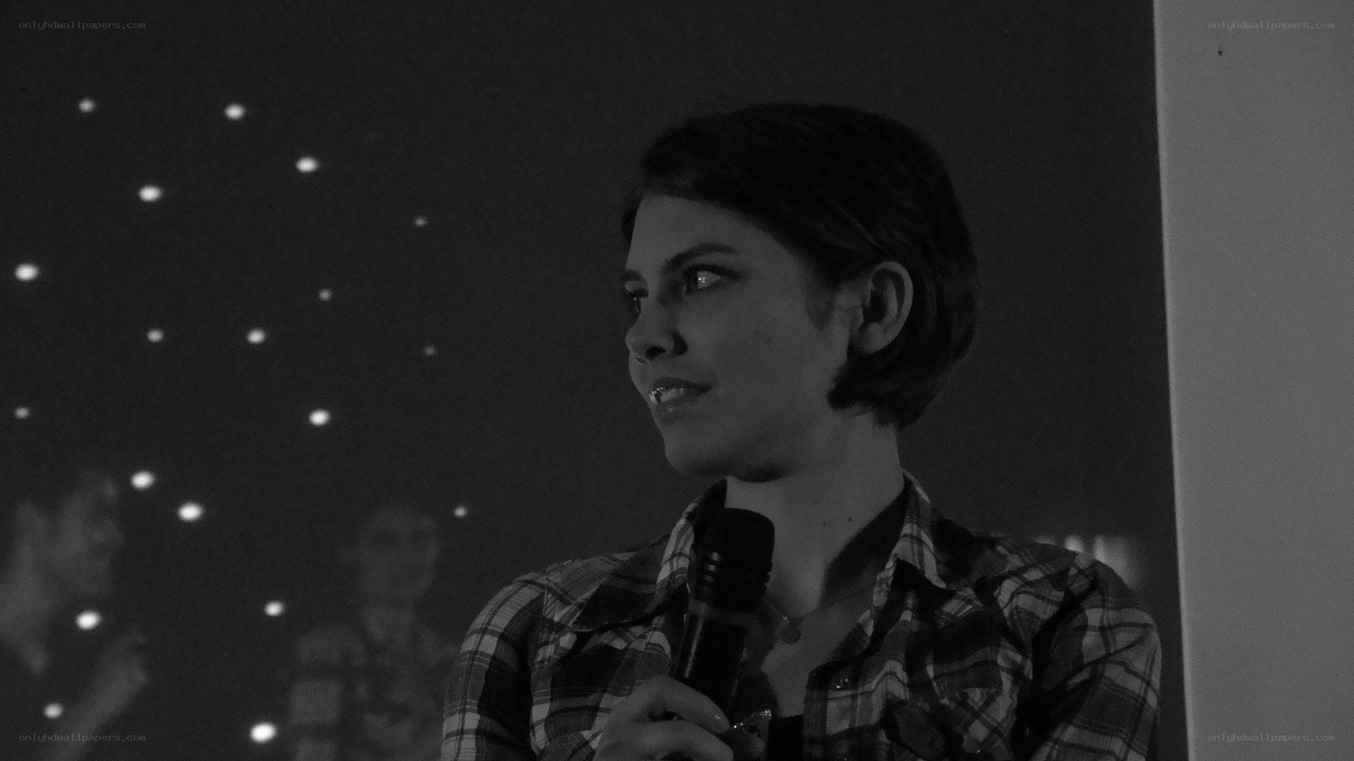 woman speaking into microphone