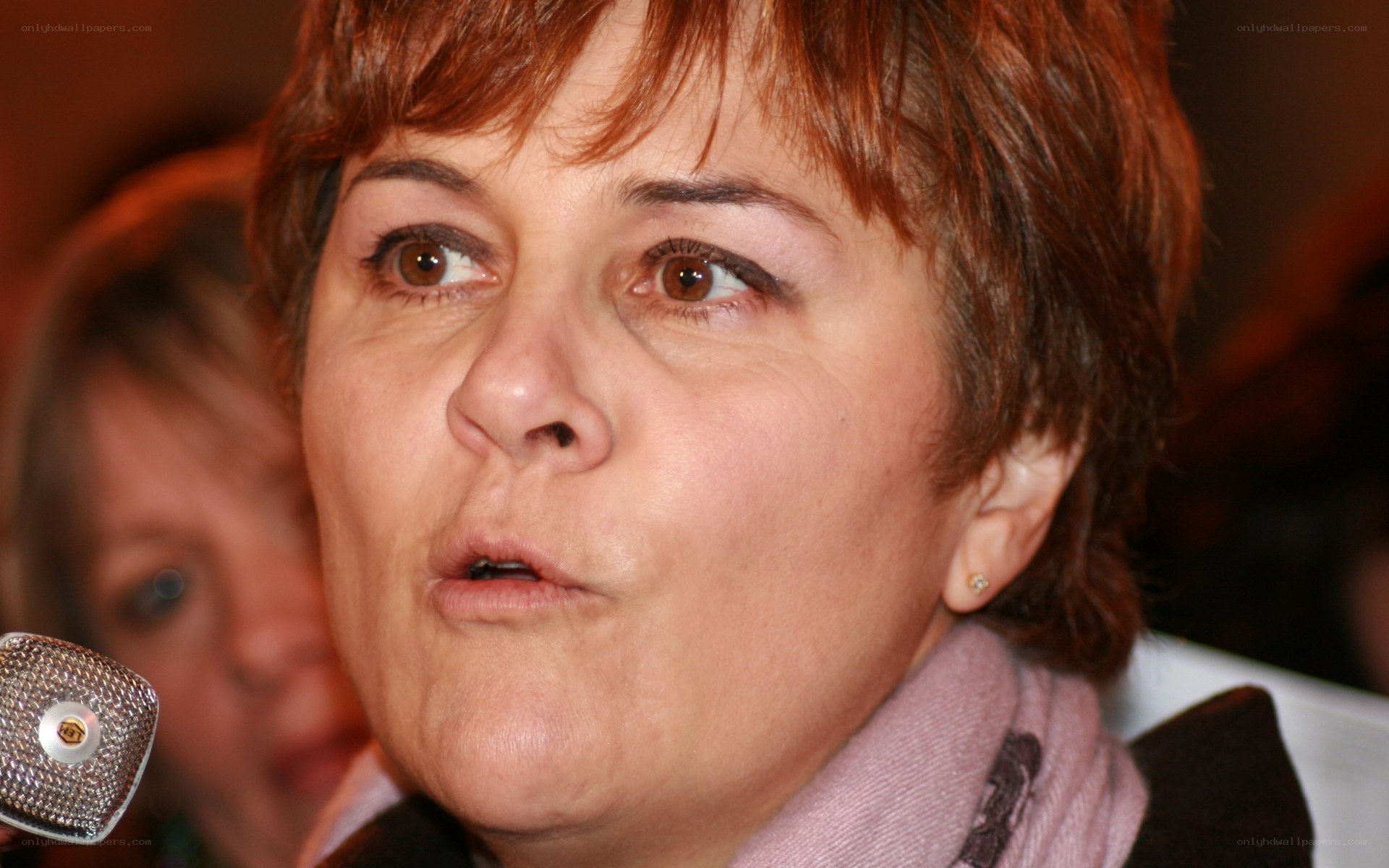 woman speaking into microphone