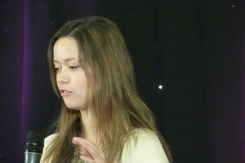 woman speaking into microphone