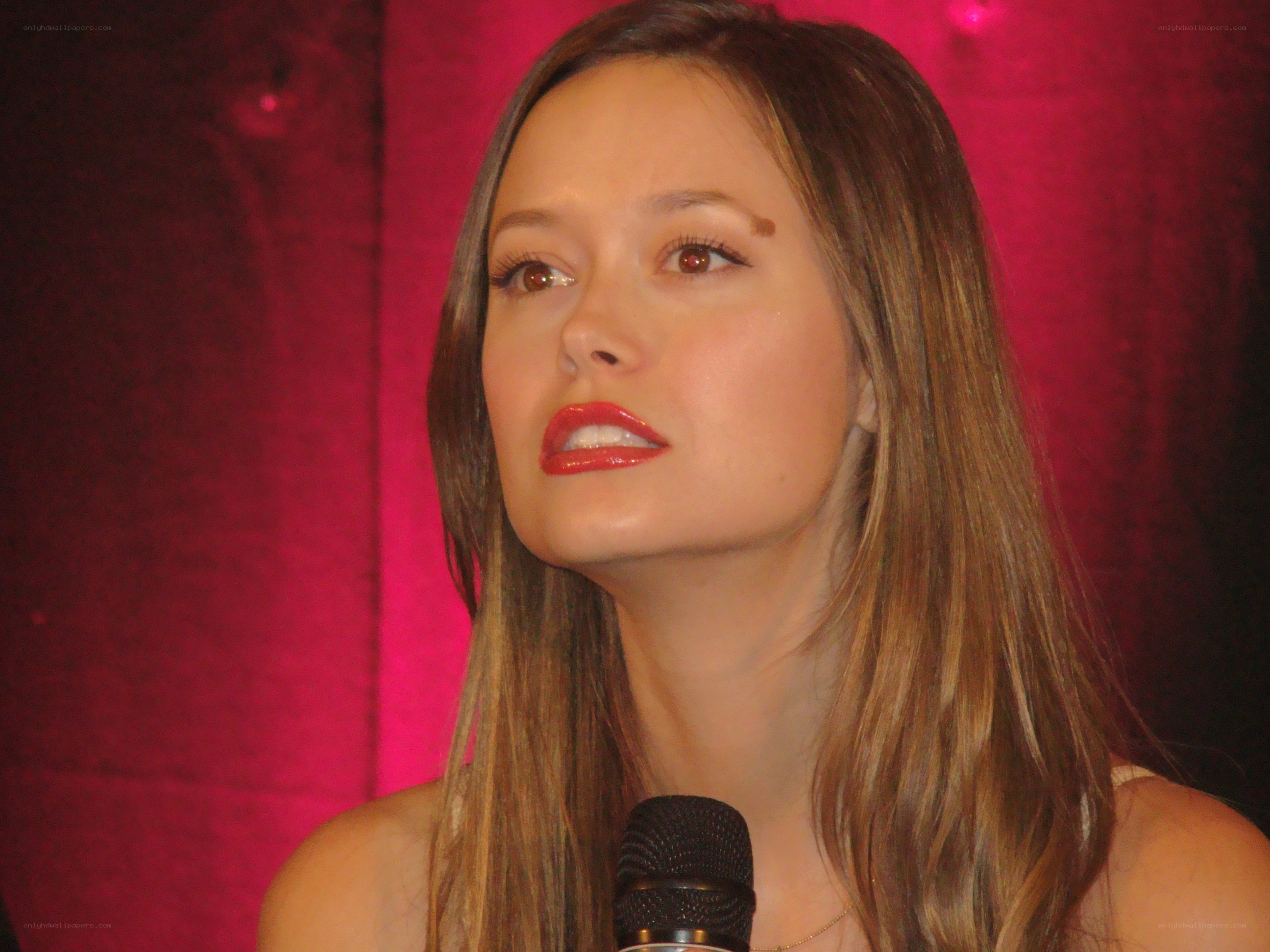 woman speaking into microphone