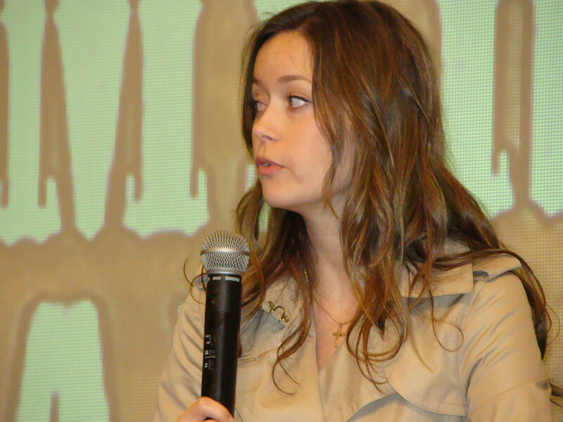woman speaking into microphone