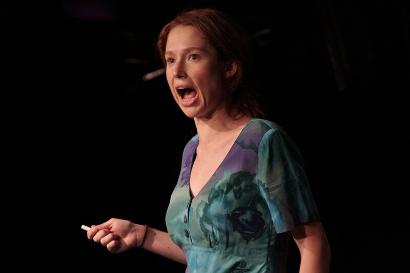Woman speaking on stage