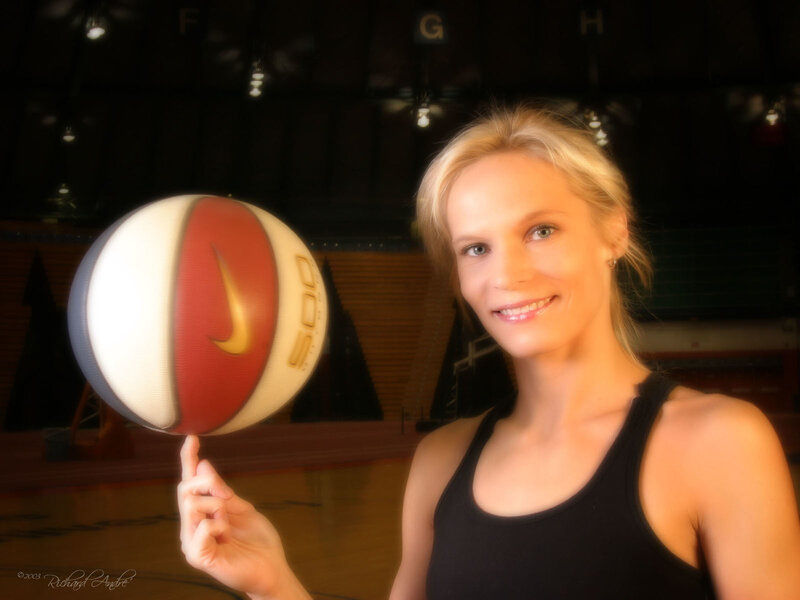 woman spinning basketball on finger