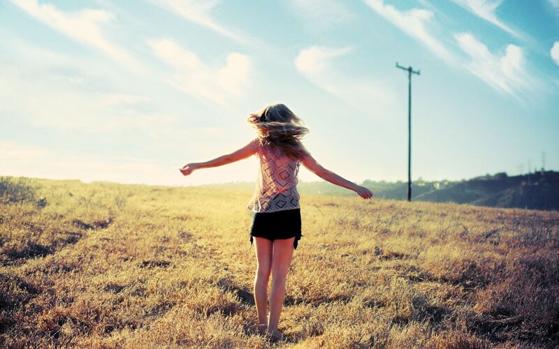 woman spinning in a field