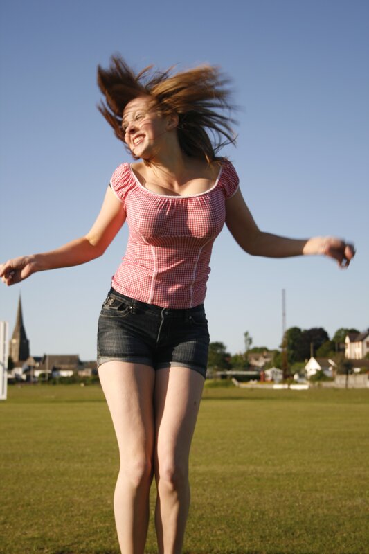 woman spinning in a field