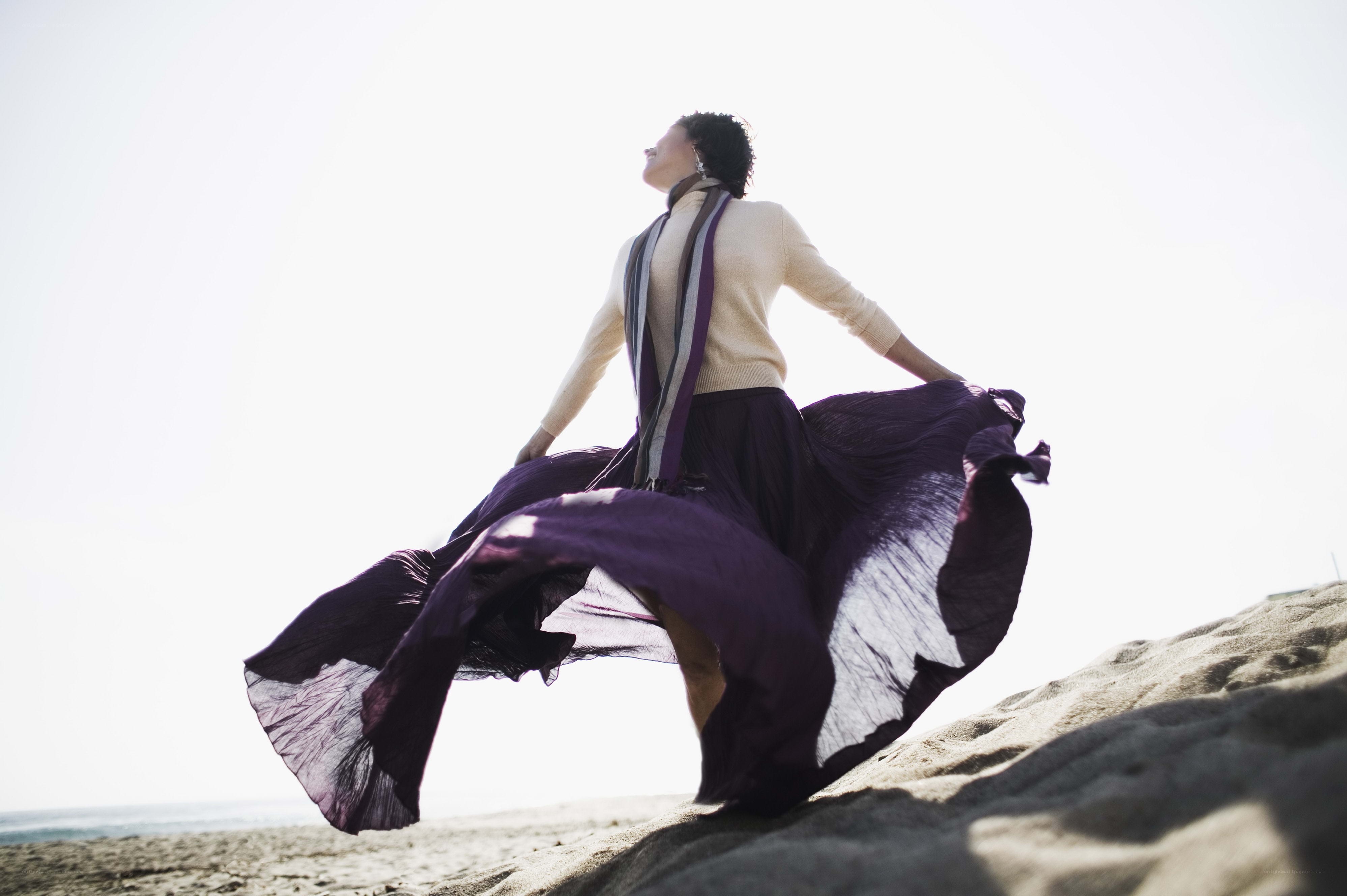 Woman spinning on the beach