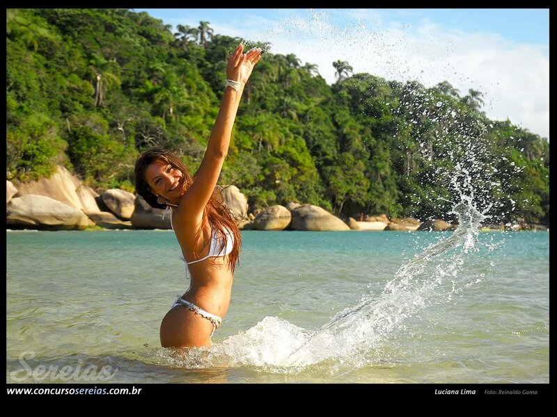 Woman splashing in ocean