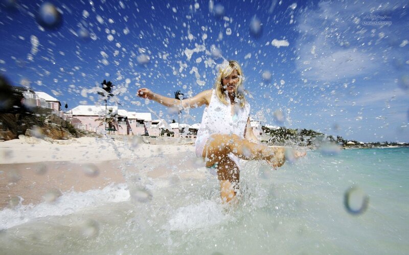woman splashing in ocean water