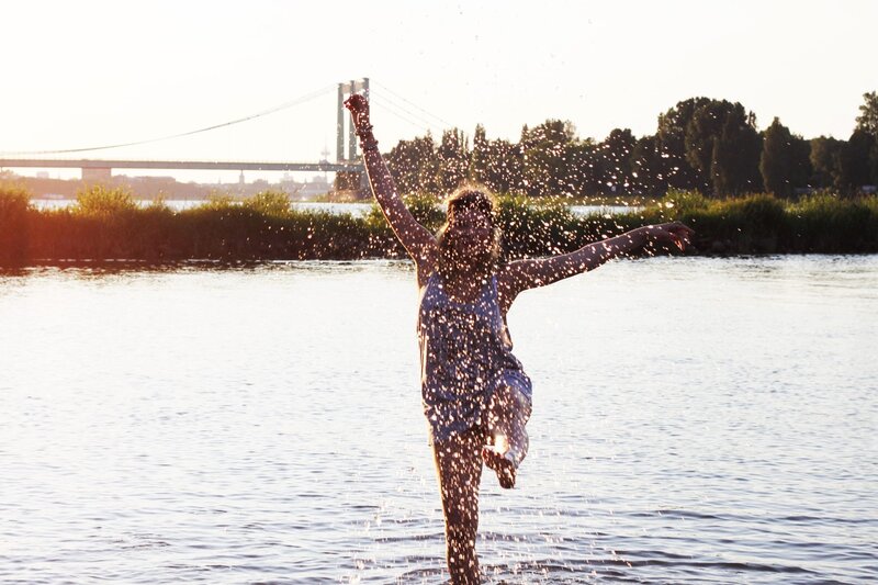 woman splashing in river