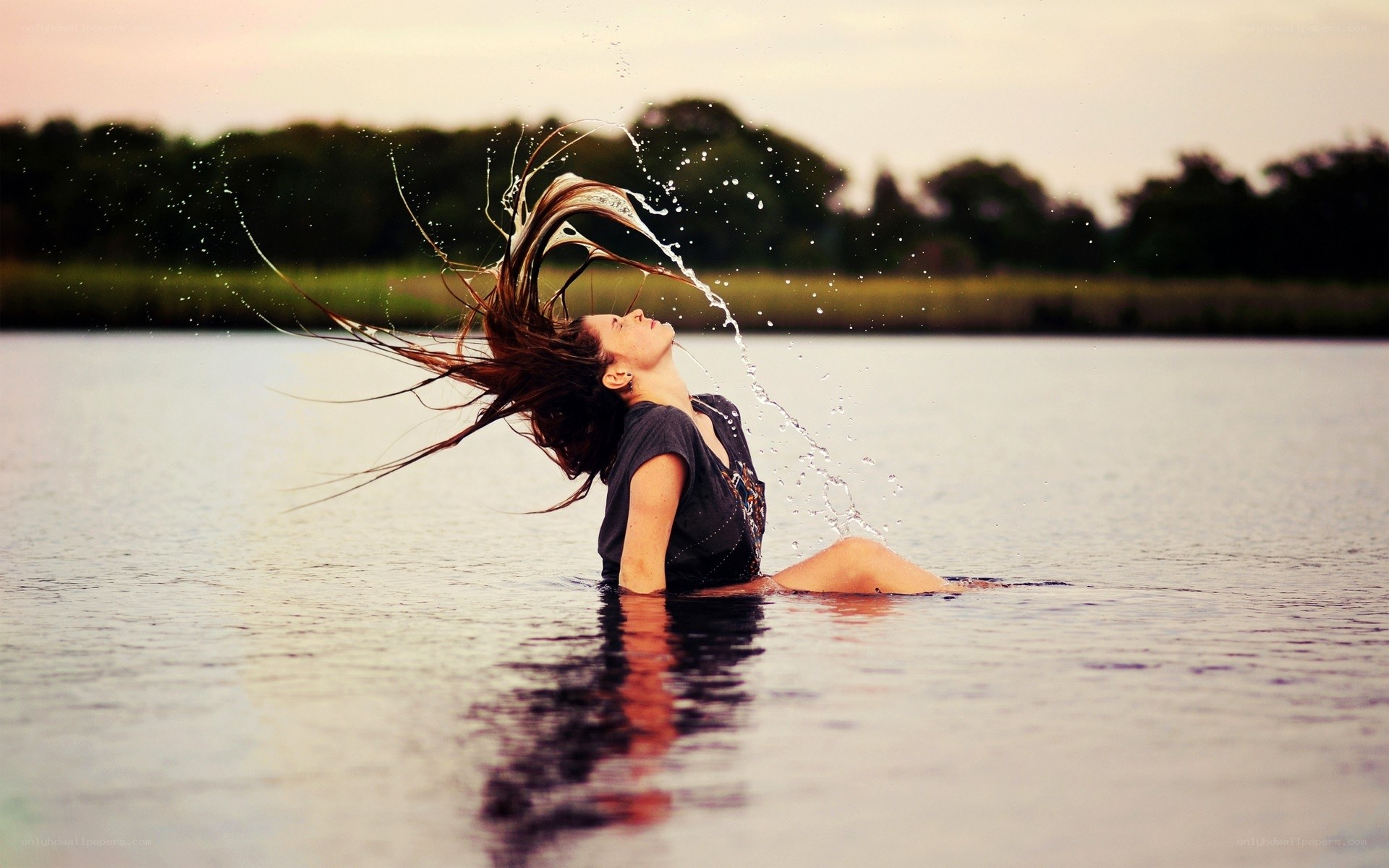 woman splashing in water
