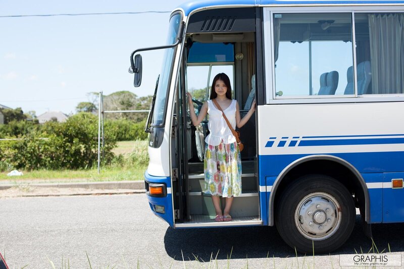 Woman standing at bus door