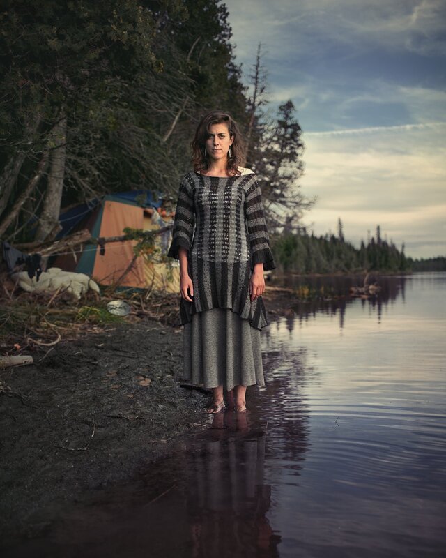 Woman standing at lake shore