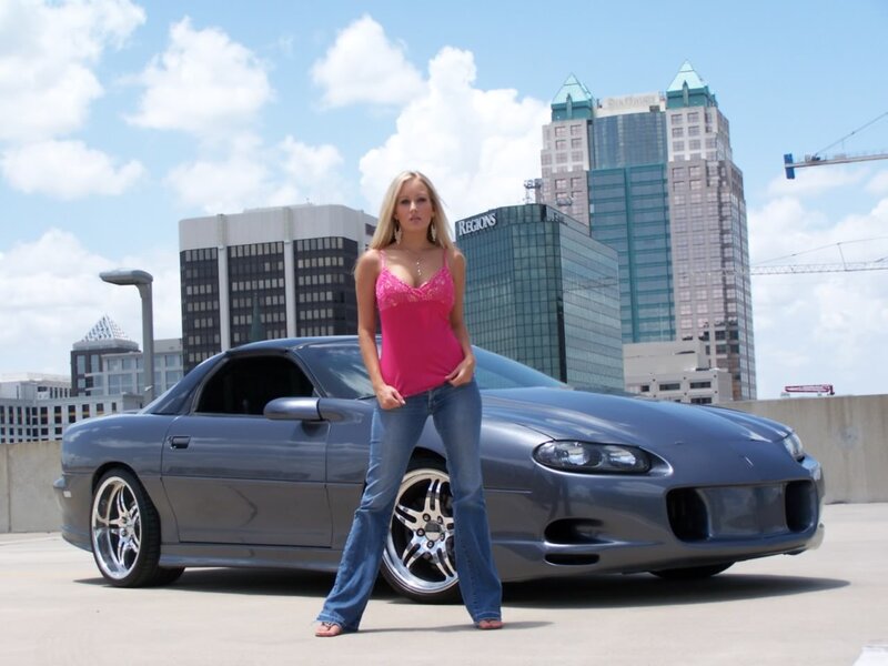 woman standing by a car