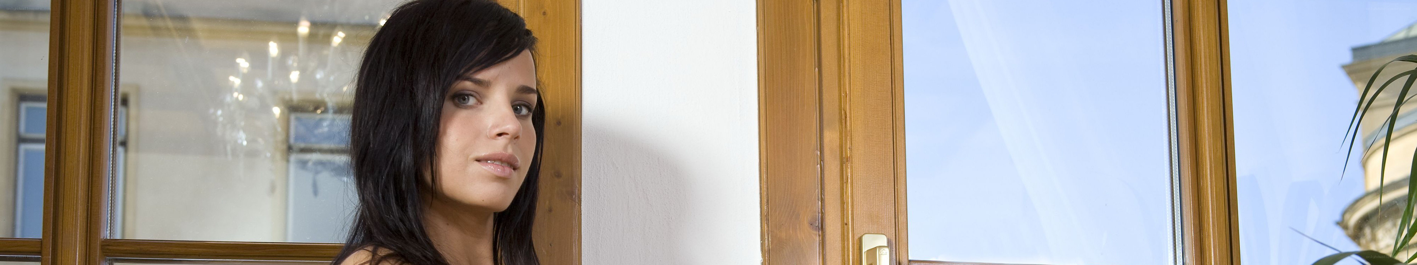 woman standing by a window