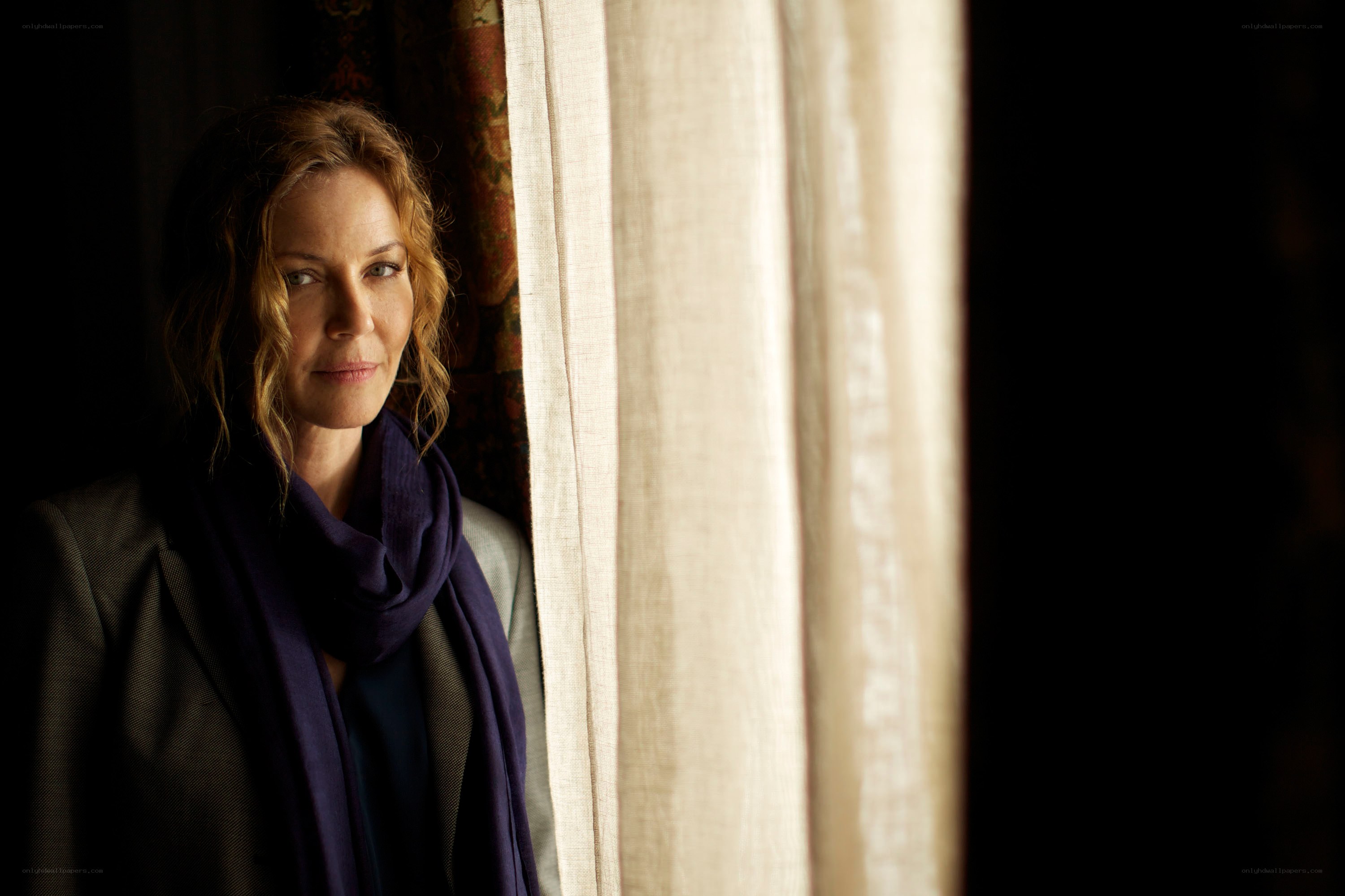 woman standing by a window