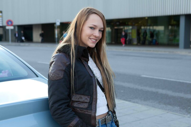 woman standing by car