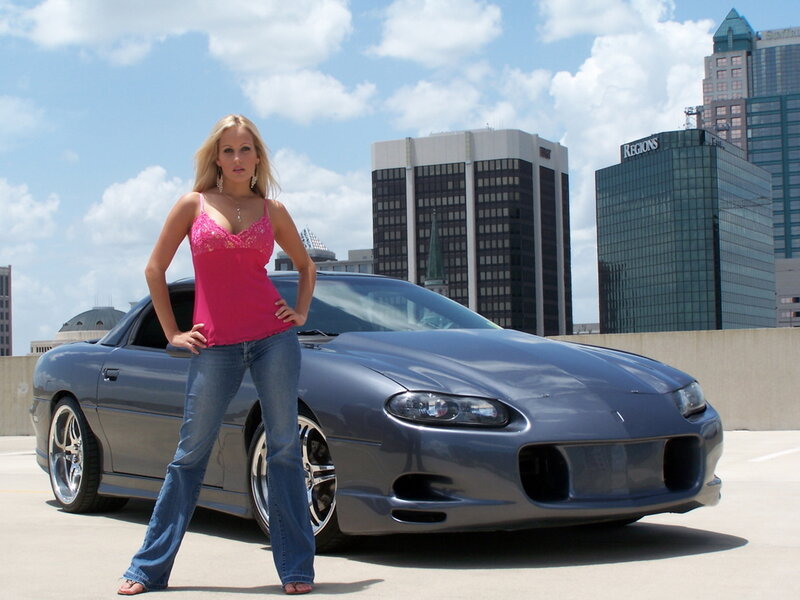 Woman Standing by Car — Blue, Confident