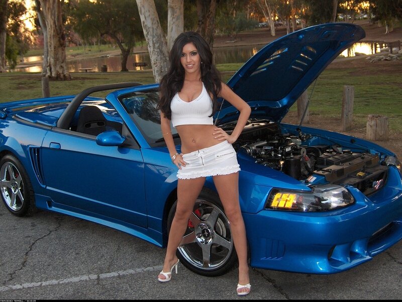 Woman Standing by Car — Blue, Relaxed, Sunset