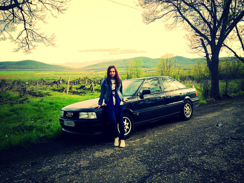 Woman Standing by Car — Green, Serene